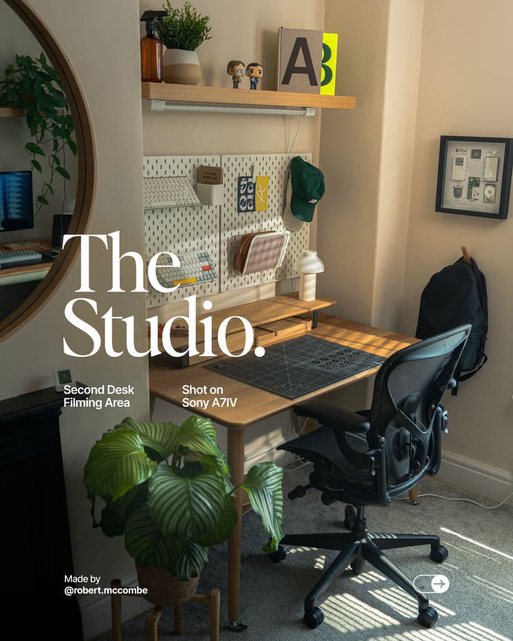Home studio desk with pegboard, prints and working tools